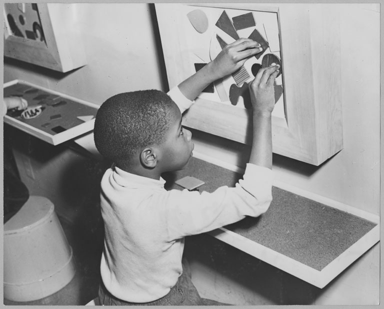 A young partcipant in MoMA's <i>Children’s Holiday Carnival of Modern Art,</i> December 5, 1950–January 7, 1951. Photographic Archive. The Museum of Modern Art Archives, New York