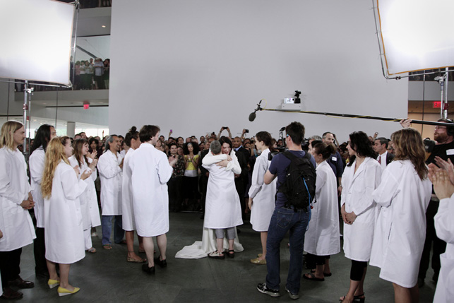 Marina Abramović greets the performers who reperformed her works during the exhibition. © 2010 Photograph by Marco Anelli