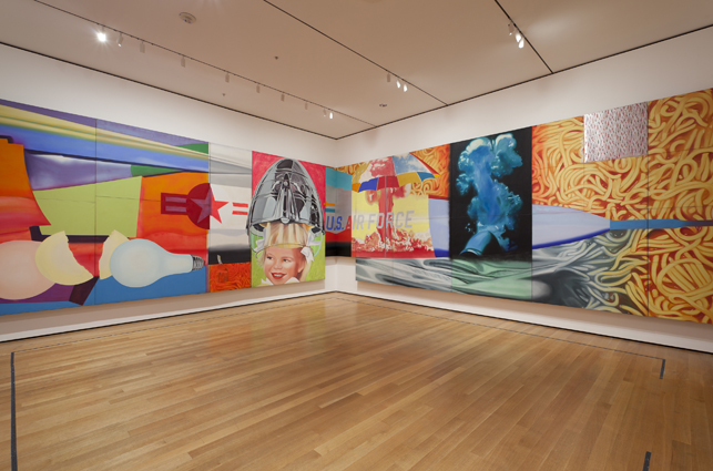 Installation view of James Rosenquist: F-111 (1964-65) at MoMA. Oil on canvas with aluminum, 23 sections. 10 x 86’ (304.8 x 2621.3 cm). Gift of Mr. and Mrs. Alex L. Hillman and Lillie P.Bliss Bequest, both by exchange. © 2012 James Rosenquist / Licensed by VAGA, New York, NY. Photo by Jonathan Muzikar.
