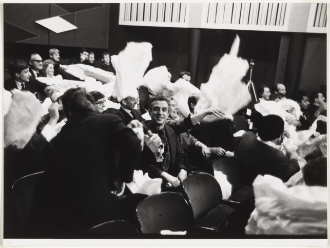 Benjamin Patterson. Audience members participating in Paper Piece (1960), performed during Fluxus Festival/Theatre Compositions/Street Compositions/Exhibits/Electronic Music, Hypokriterion Theater, Amsterdam, June 23, 1963. Original Photographer: Oscar van Alphen. The Gilbert and Lila Silverman Fluxus Collection Gift. Photo: Peter Butler. 
