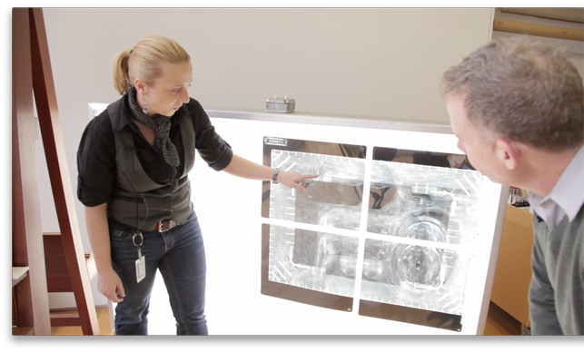 Conservators Cindy Albertson and Michael Duffy examine an x-ray of René Magritte’s The Portrait Conservators Cindy Albertson and Michael Duffy examine an x-ray of René Magritte’s The Portrait