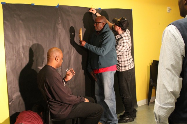 D-UP participants pose with objects and trace their shadows 