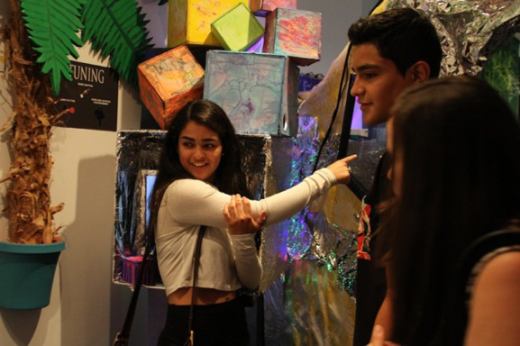 Teens playing the games and exploring the space