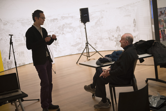 Alvin Lucier recording I Am Sitting in a Room at The Museum of Modern Art, New York, on Saturday, December 20, 2014. Assisted by James Fei and accompanied by his wife Wendy Stokes. Photo: Amanda Lucier. © 2015 Amanda Lucier