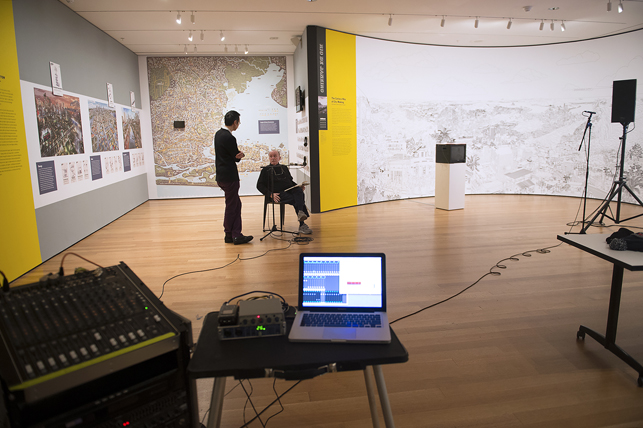 Alvin Lucier recording I Am Sitting in a Room at The Museum of Modern Art, New York, on Saturday, December 20, 2014. Assisted by James Fei and accompanied by his wife Wendy Stokes. Photo: Amanda Lucier. © 2015 Amanda Lucier