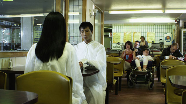 Production still from Piercing Brightness. 2013. Directed by Shezad Dawood. Pictured: Chen Ko and Jennifer Lim. Courtesy of UBIK Productions Ltd