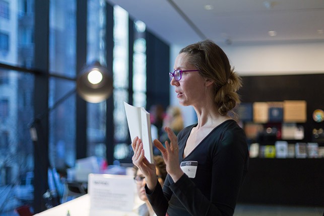 Elizabeth Zuba, poet and translator, showing an example of an erasure
