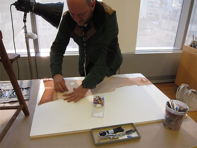 Roger Griffith testing different methods of tearing and distressing the nylons.